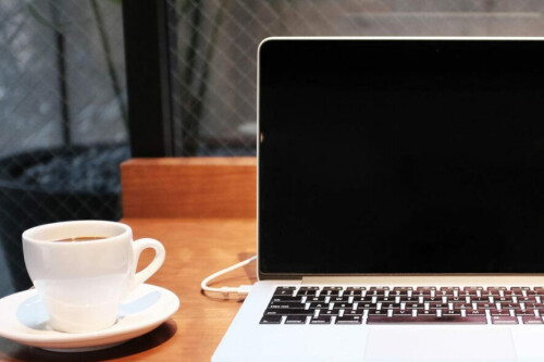 laptop-on-desk-with-coffee-cup-886x590.jpg