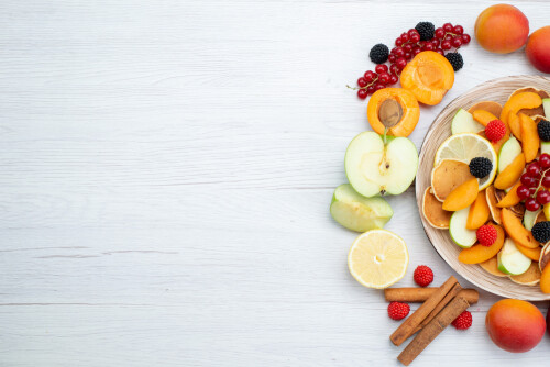 top-view-fresh-fruits-colorful-ripe-wooden-desk-white-background-fruits-color-food-photo.jpg