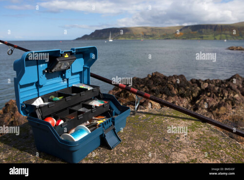 fishing-tackle-box-filled-with-sea-fishing-gear-and-rod-on-the-county-BME43F.jpg
