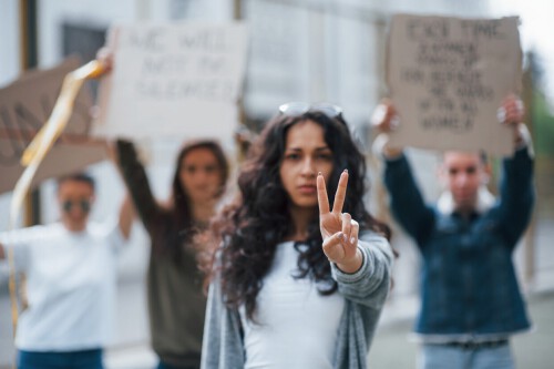 showing-gesture-by-two-fingers-group-feminist-women-have-protest-their-rights-outdoors.jpg