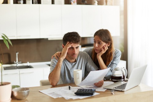 young-couple-checking-their-family-budget.jpg