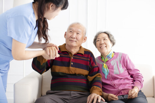 health-visitor-and-senior-couple-during-home-visit.jpg