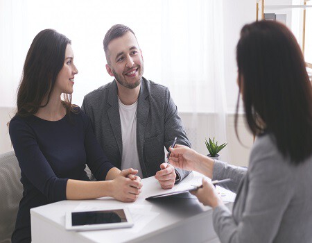 young-family-listening-to-financial-advisor-ready-to-sign-credit-contract.jpg