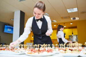 employee-setting-up-catering-event-300x200.jpg