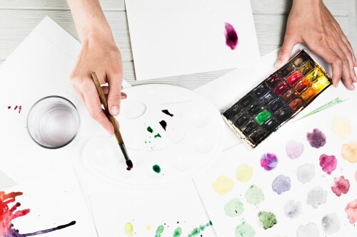 overhead-view-hand-mixing-watercolor-painting_23-2148193663.jpg